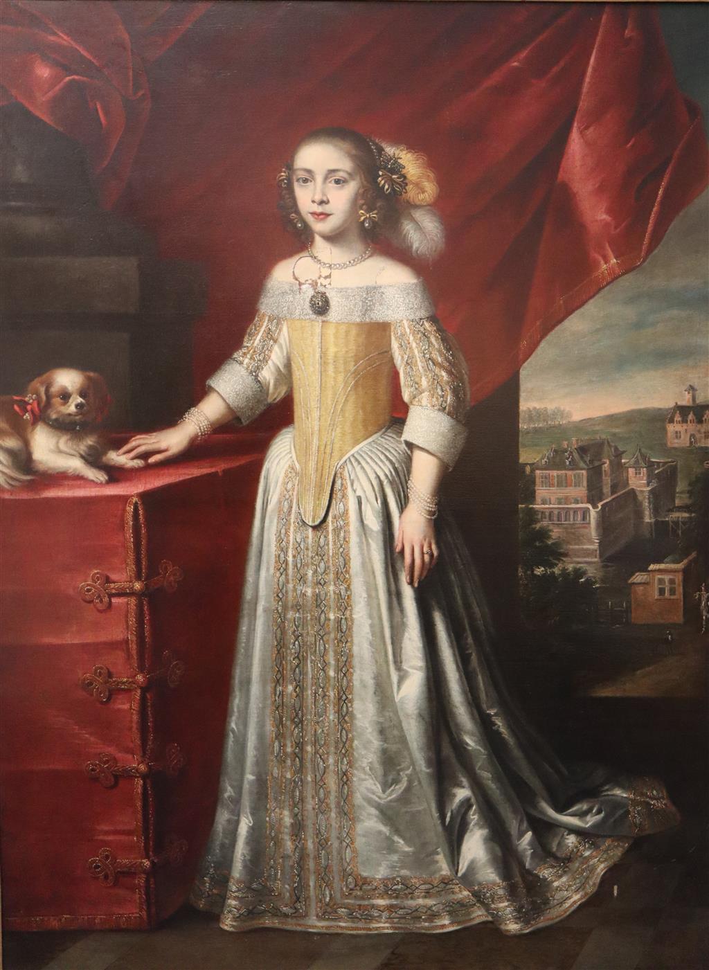 Circle of John Wessop (fl.1640-1652) Full length portrait of a young lady, standing beside a lap dog, a country house beyond 64 x 47in.